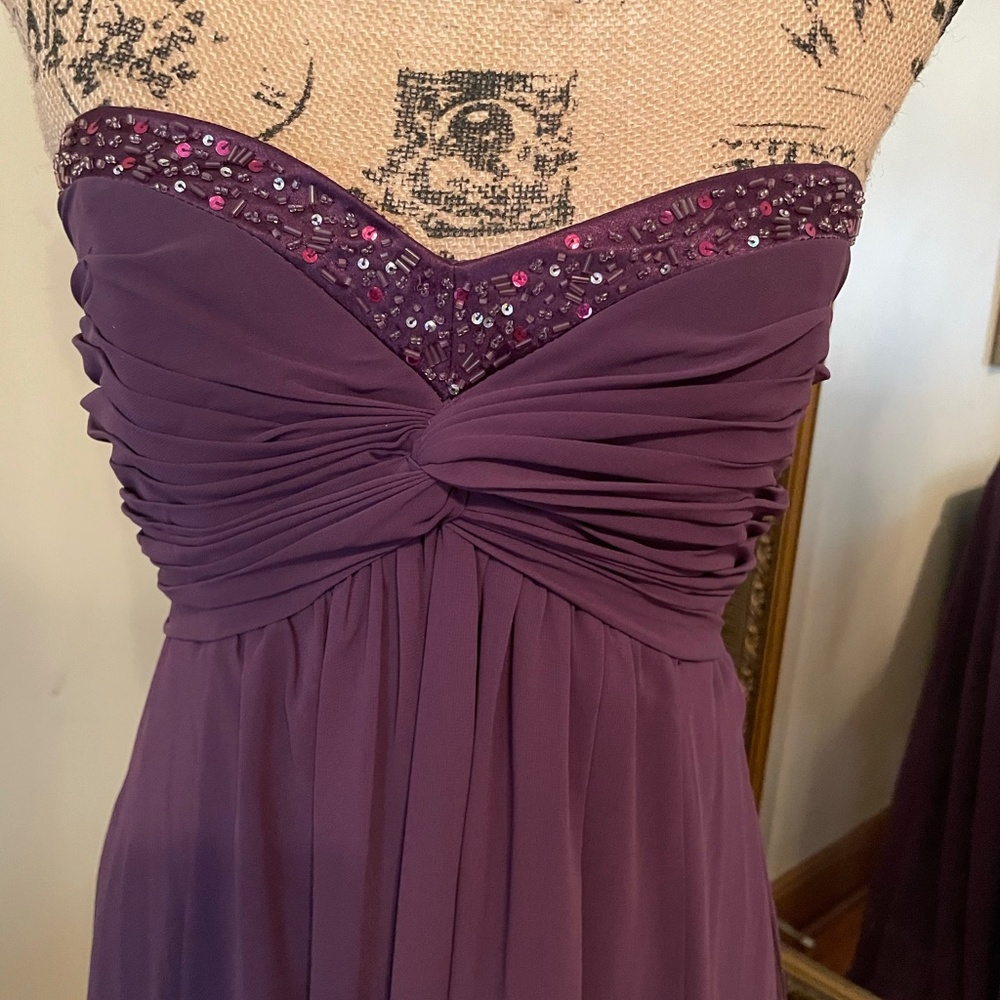 Size 4 David’s Bridal gown. Blue sequin.